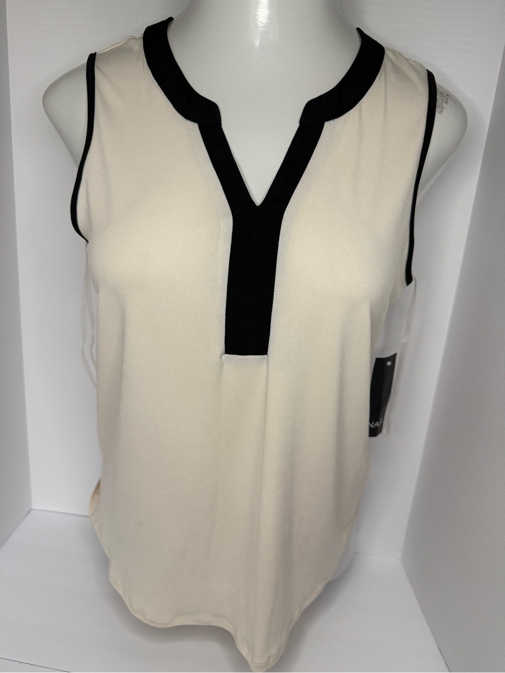 NAIF Cream Sleeveless Blouse with Black Trim